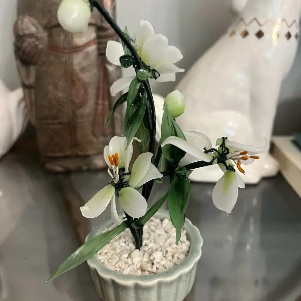 Vintage jade quartz tree in celadon pot. White and Green Plant.